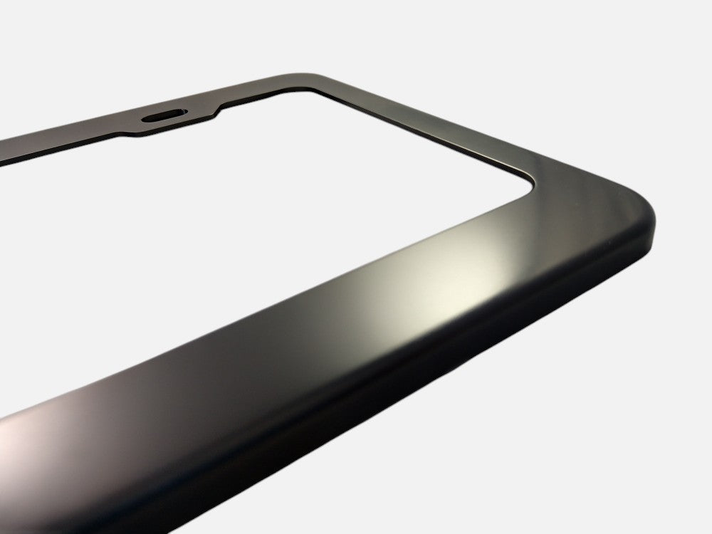 Black anodized aluminum license plate frame finish close-up