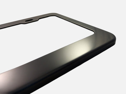 Black anodized aluminum license plate frame finish close-up
