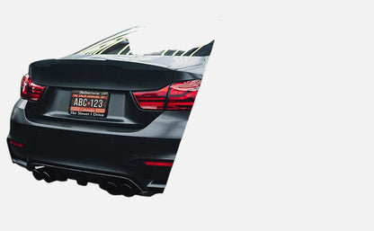 GoPlates custom laser-engraved anodized aluminum license plate frame installed on the rear of a black luxury car.