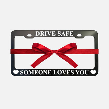 GoPlates black anodized aluminum license plate frame with laser engraved text and a red gift ribbon