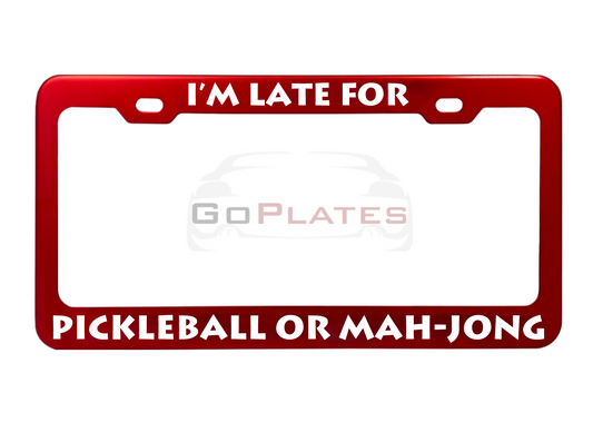 I'm Late for Pickleball or Mah-Jong red anodized aluminum license plate frame